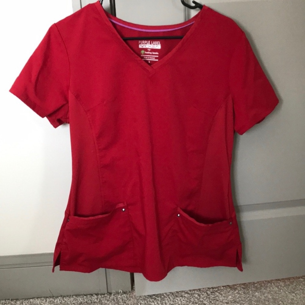 Red pair of healing hands scrubs
